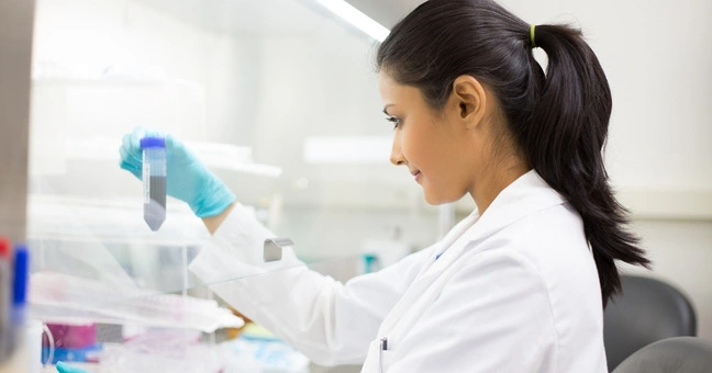 Magnesium bisglycinate powder being processed in a laboratory for quality control testing