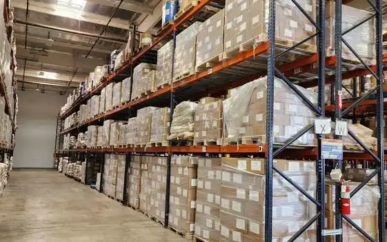 Bulk warehouse storage racks containing amla fruit powder inventory
