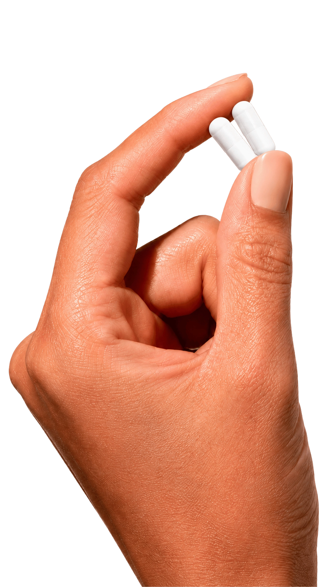 Hand holding two veggie capsules