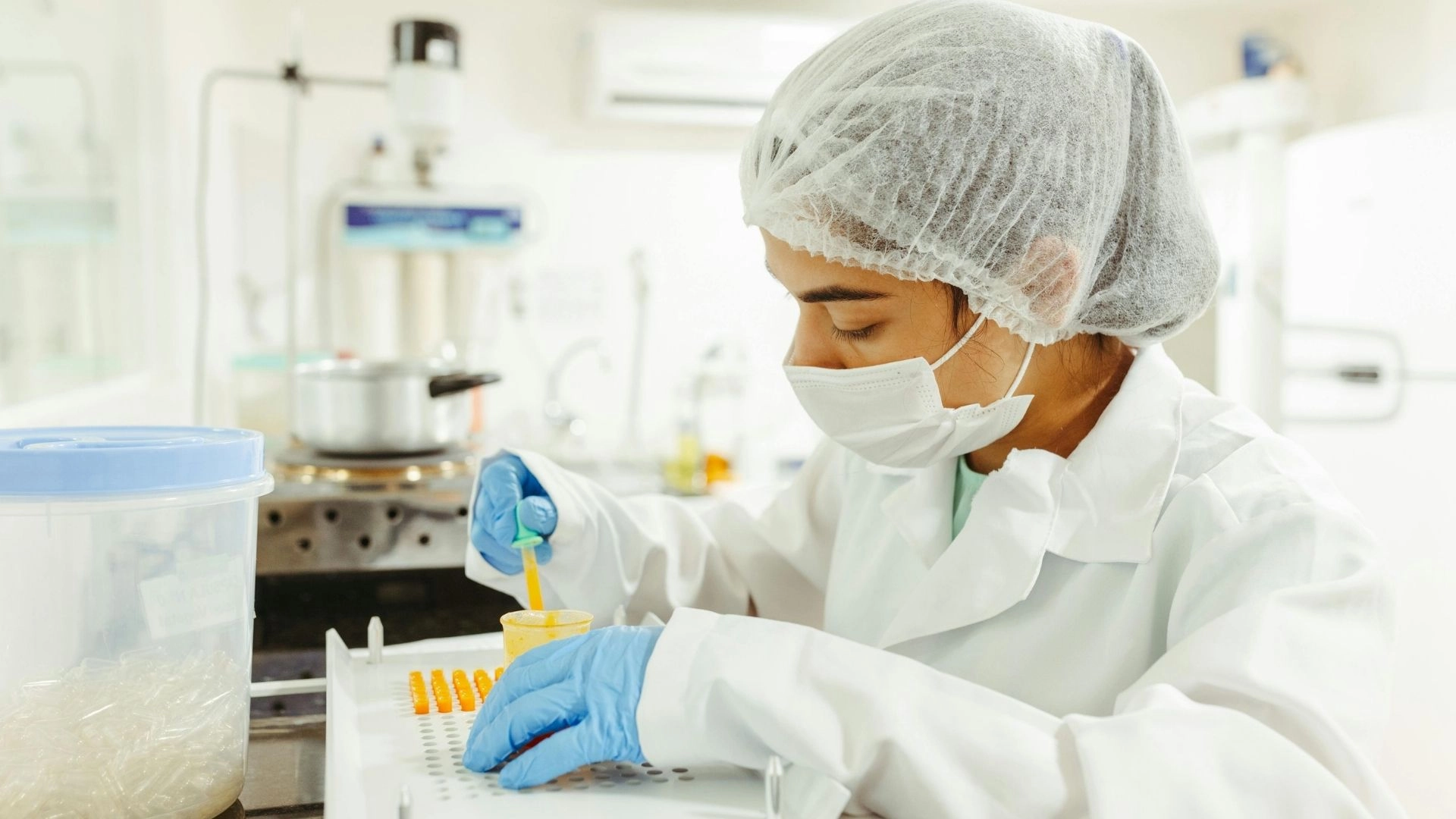 Lab technician testing capsules