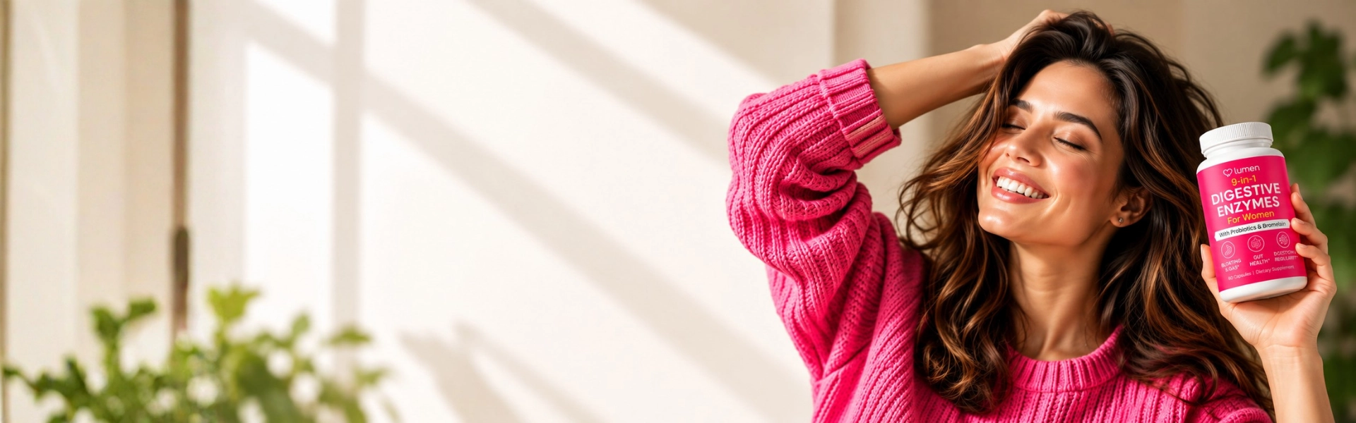Smiling woman in a pink sweater holding a bottle of Lumen 9-in-1 Digestive Enzymes